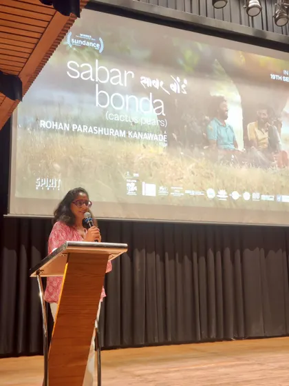 Patricia Loison, Director of Alliance Française de Delhi, addresses the audience at a film premiere. Our leadership is actively involved in creating a welcoming and enriching cultural experience for our guests.