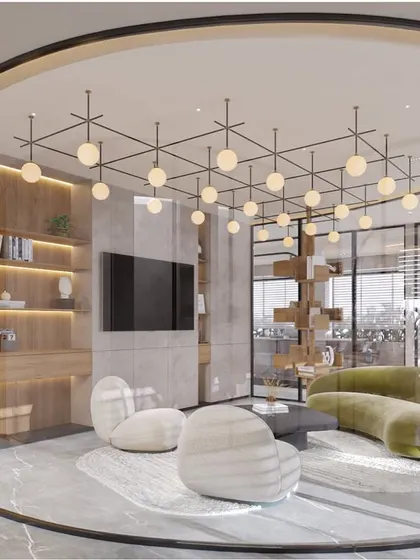 A breakout lounge area within the office, enclosed by a curved glass wall. This space provides a comfortable, semi-private area for informal meetings or relaxation, complete with a media wall and sculptural seating.