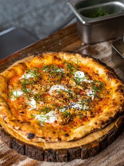 A unique pizza topped with creamy cheese and fresh scallions. This shows that I love to experiment with flavors while staying true to my Neapolitan roots.