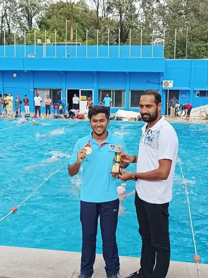 Chithanya receiving the 'Best Male Athlete' trophy at the State Senior Waterpolo Championship. This award highlights the individual talent we cultivate within our team-focused environment.