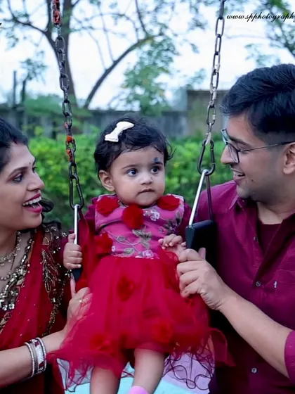 A playful moment on a swing set during an outdoor family photoshoot. We love capturing these simple, happy activities that define a family's time together.