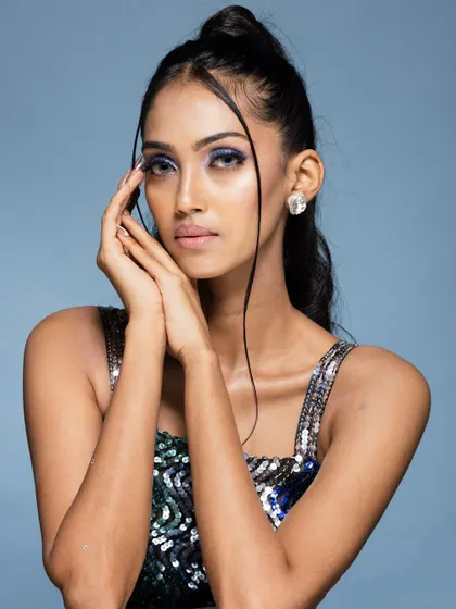A soft and gentle portrait from the same sequin dress shoot, showing a different mood.