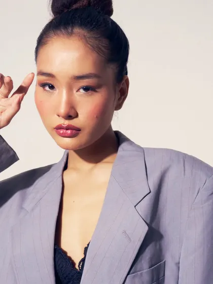 A modern and chic look. I created a glowing skin look with a glossy lip and a sleek top knot, paired with an oversized blazer for a high-fashion feel.