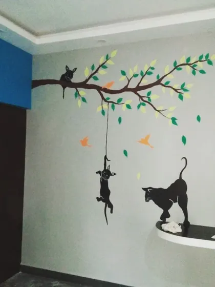 A playful mural for a child's room or family space, featuring cat silhouettes on a tree branch. I can create custom themes to match your family's personality.