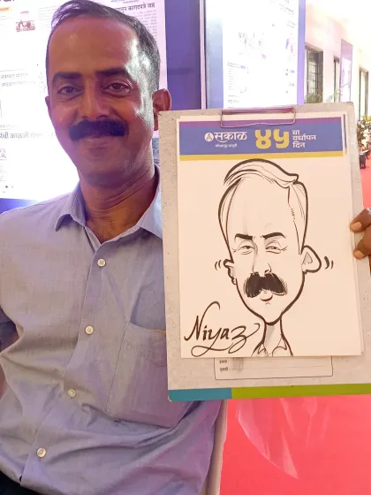 This gentleman was all smiles after getting his caricature done at the Sakal Media event. My goal is to make corporate events less formal and more fun.
