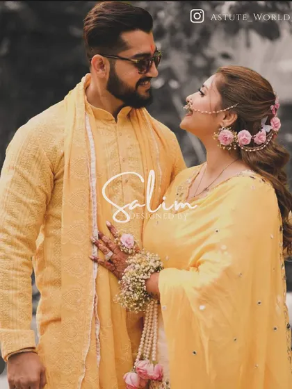 A couple at their haldi ceremony. I designed the groom's simple yet elegant yellow textured kurta and stole, perfectly complementing the festive and joyful occasion.