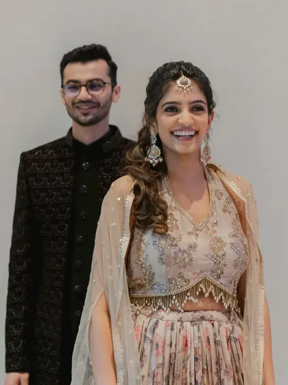 The happy couple. Her makeup is fresh and radiant, perfect for a night of dancing and celebration.