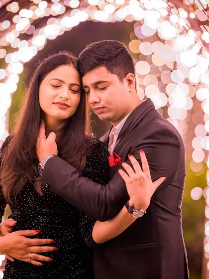 An emotional and intimate embrace within the tunnel of lights. The soft, glowing background creates a beautiful bokeh, focusing all the attention on the couple's connection.