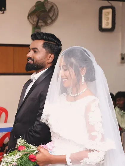 A candid moment during the church ceremony. The groom's look is designed to be sweat-proof and long-lasting, keeping him fresh throughout the day.