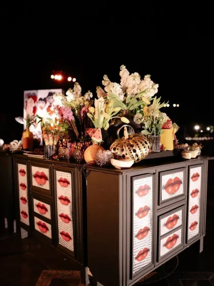 A custom bar designed with pop-art lip motifs, tying into the bold and artistic theme of the sangeet. Even functional elements are designed to be part of the artistic narrative.