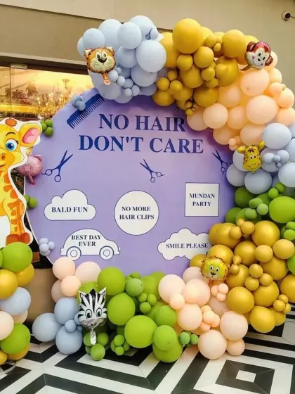 Mundan ceremonies can be fun and quirky. This "No Hair Don't Care" backdrop with a colorful balloon garland and jungle animal cutouts is a popular and playful option I offer for the big haircut day.