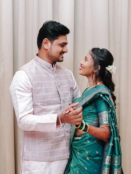 A sweet, candid moment from an engagement shoot, with the couple sharing a loving gaze.