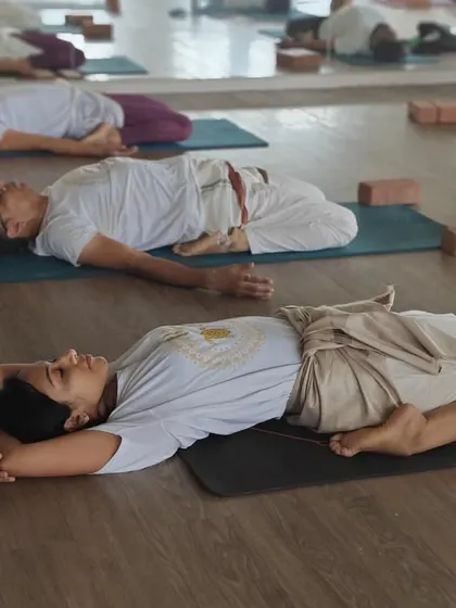 The journey of a teacher begins with the stillness of a student. Here, our TTC batch practices Supta Virasana (Reclined Hero Pose), a restorative posture that teaches deep relaxation and hip flexibility.