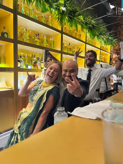 Our founder Sid sharing a fun moment with the bride at her wedding. We often feel like part of the family, and we cherish these connections.