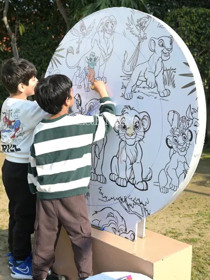An interactive coloring station for kids at the Lion King party, allowing them to engage with the theme creatively.