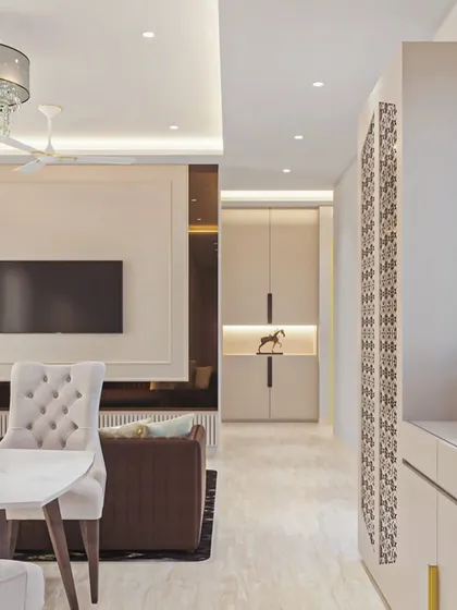 This view showcases how different elements come together. The formal dining area with its crystal chandelier transitions smoothly into a more relaxed living space, with thoughtful decor creating distinct zones.