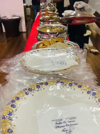 A look at our buffet line from the guest's perspective. We ensure plates and our branded napkins are readily available for a convenient and hygienic serving experience.