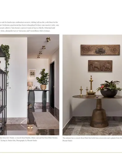 The foyer of the Bengaluru apartment, featuring a custom console table and traditional Indian brass lamps (diyas), creating a warm and welcoming entrance.