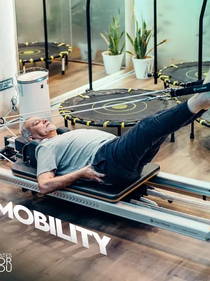 We focus on improving mobility at any age. This client is working on a leg press series on the Reformer, a safe and effective way to build strength and increase range of motion in the hips and knees.