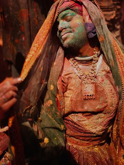 A vibrant collection of images from the Holi celebrations in Braj, specifically Nandgaon. This series captures the pure ecstasy of the festival, with portraits of devotees, men dressed as gopis, and crowds dancing in a cloud of colors.