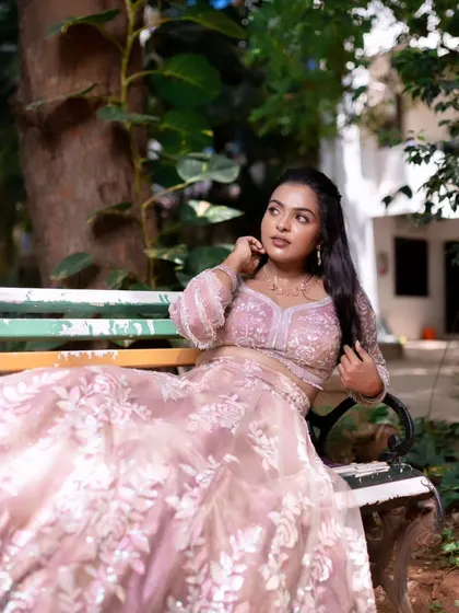 A model showcasing a glowing and radiant look in a beautiful outdoor setting.
