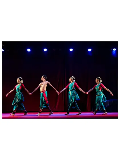 The ensemble holding hands, symbolizing unity and connection in "Tyāgarāja Hṛt Sādana." This formation represents the bonds that tie the characters and the dancers together.