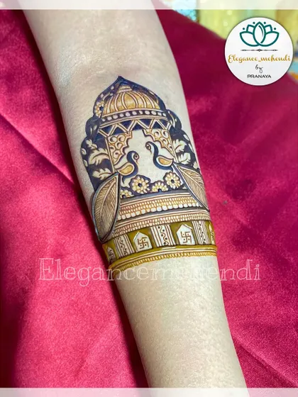 An elegant bridal startup design with two peacocks perched atop a beautiful architectural dome.