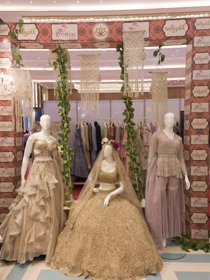 A boho-chic setup for our collaboration with Samyakk, featuring macrame hangings and mannequins in elegant, earthy-toned outfits.