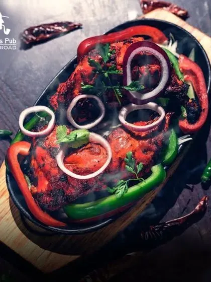 My Tandoori Chicken sizzler is a feast for the senses. Served hot and steaming with fresh peppers and onions, it's a dish you won't forget.