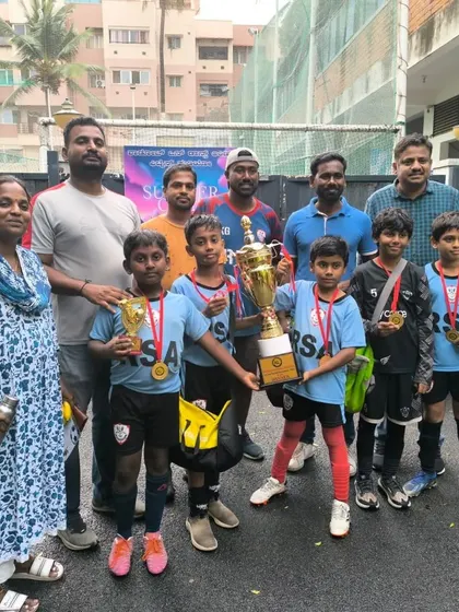 Our U10 champions with their parents and coaches, celebrating a great team effort and victory.