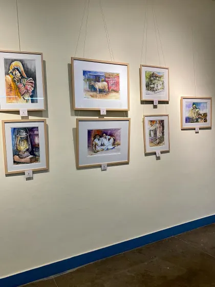 Another angle of my displayed works at the exhibition. Each painting represents a different story and a different part of my artistic exploration.
