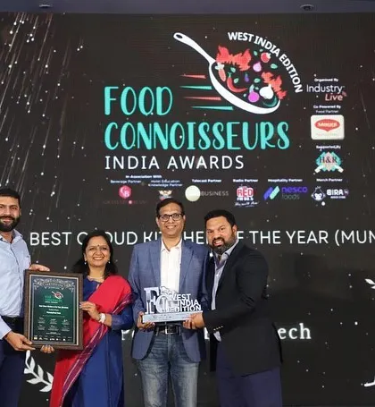 I am proud to be on stage receiving the Food Connoisseurs India Award for 'Best Cloud Kitchen of the Year' in Mumbai. This recognition reflects my commitment to quality and excellence.