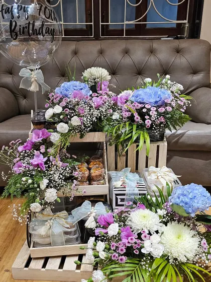 Celebrating a 70th birthday calls for something truly grand. I curated this spectacular arrangement with tiers of delicious treats, lush floral displays, and personalized touches to honor such a special milestone in the most beautiful way.