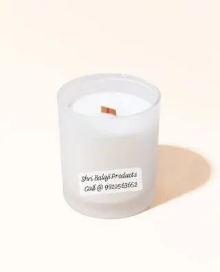 A finished candle made with one of my wooden wicks, placed in a frosted glass jar. This creates a modern and cozy aesthetic that is very popular.