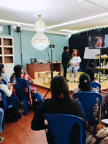 This image shows the full classroom setup, including the lighting, stage, and seating arrangement. I ensure the environment is professional and conducive to learning, allowing every student to feel like they are getting a front-row seat.