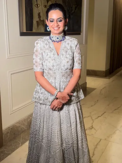 Glowing and glamming. Shubh looked radiant in this silver and blue lehenga, with makeup that was clean, fresh, and elegant.