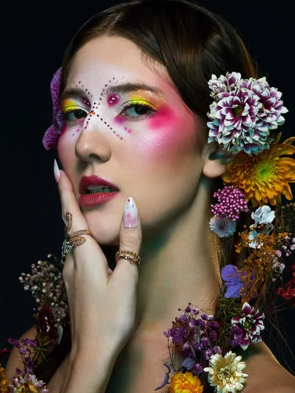 A stunning high-floral shoot from our Delhi batch, featuring intricate, colorful makeup and beautiful flower arrangements.