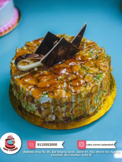 A crunchy and delicious Almond Delight cake. It's covered in toasted almonds and caramel, offering a wonderful texture and nutty flavour.