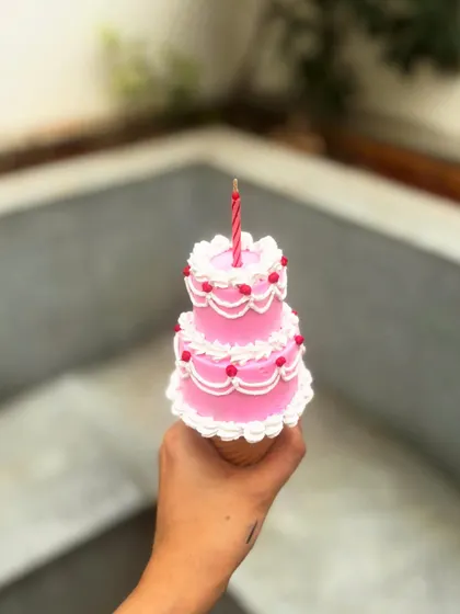 Because adulting is hard, but eating cake is easy. This is my ice cream cone cake, which features a mini two-tier cake piped on top of an actual cone.
