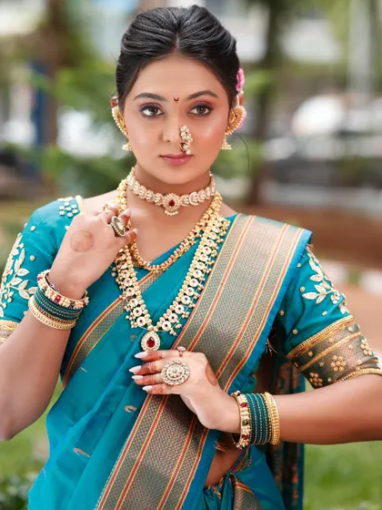 The model posing with her hands, showing the coordination of her nail polish and bangles.
