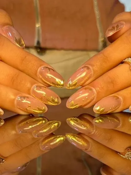 A luxurious design with a sheer nude base and abstract gold foil accents, creating a rich, artistic look.