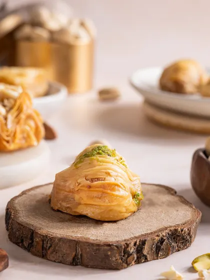 Another variety of baklava, this one with a pistachio garnish, showcasing the different options available.