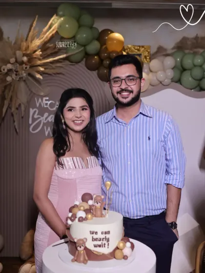 The cake cutting moment is always so special. Here are the happy parents-to-be with their custom teddy bear cake that perfectly matched the green and brown boho baby shower decor.