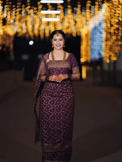 The gorgeous bride Iva, looking regal in a deep purple brocade saree and blouse for her reception. The outfit was designed to have a royal and timeless feel.
