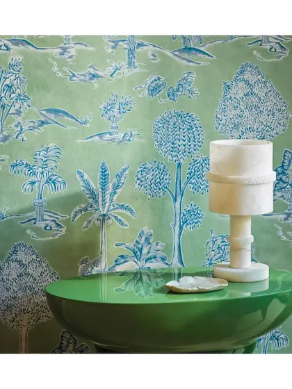 Inspired by ornamental Greek gardens, the Karuna wallpaper from Osborne & Little features sculpted urns and decorative columns nestled among lush foliage. Shown here in an apple and denim palette, it adds oomph and glamour to a drawing room or boudoir.