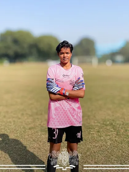 Our goalkeeper stands ready, the last line of defense and a crucial part of our championship-winning squad. Her presence commands respect and inspires confidence.