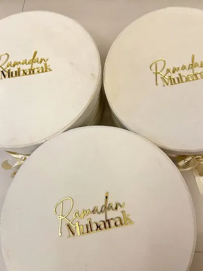 A stack of my signature velvet Ramadan hampers, ready to be filled with curated goodies.