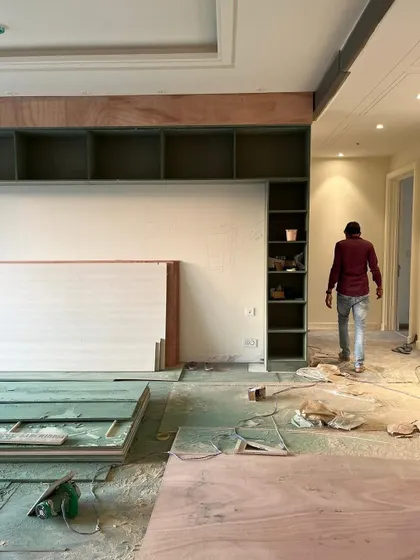 A sea of green dust covers the floor as we work on the built-in shelving unit. This is the beautiful mess that happens right before a space starts to look polished and clean.