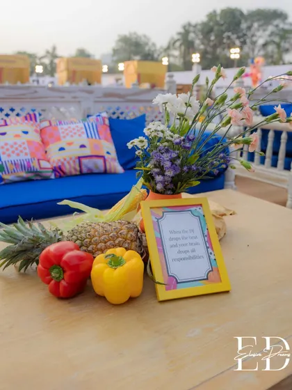 A tablescape featuring fresh produce like pineapples and bell peppers, reinforcing the sensory and organic elements of the decor.