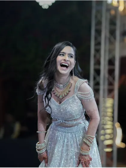 The bride's infectious laughter during a performance. We focus on capturing genuine emotions that tell the story of a night filled with joy and entertainment.